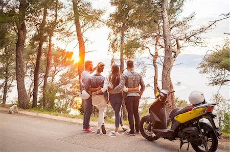 simsearch:649-08840317,k - Two couples with moped looking out at sunset from coastal road, Split, Dalmatia, Croatia Photographie de stock - Premium Libres de Droits, Code: 649-08840317