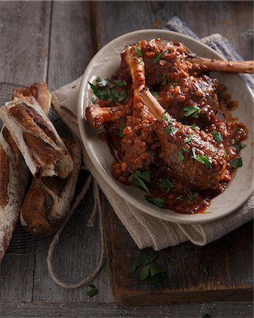 simsearch:614-08120008,k - Bistro meal of lamb shanks in red wine on table Stock Photo - Premium Royalty-Free, Code: 649-08840631