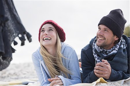 simsearch:851-02962541,k - Young couple looking up from picnic blanket at beach, Western Cape, South Africa Stock Photo - Premium Royalty-Free, Code: 649-08840664