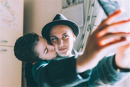 simsearch:649-08702811,k - Young lesbian couple taking smartphone selfie in kitchen Stock Photo - Premium Royalty-Free, Code: 649-08840710