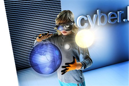 futuristic boy kid - Boy in virtual reality headset interacting with floating digital earth, moon and sun Stock Photo - Premium Royalty-Free, Code: 649-08840765