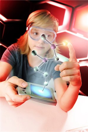 simsearch:649-08702598,k - Boy with hand held computer touching 3D molecular model Stock Photo - Premium Royalty-Free, Code: 649-08840761