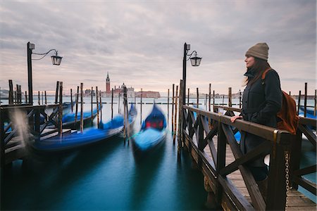 simsearch:649-07596467,k - Woman on pier by gondolas in Grand Canal, San Giorgio Maggiore Island in background, Venice, Italy Stockbilder - Premium RF Lizenzfrei, Bildnummer: 649-08859948