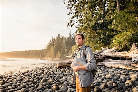 Man gazing from beach in Juan de Fuca Provincial Park, Vancouver Island, British Columbia, Canada Stock Photo - Premium Royalty-Free, Code: 649-08859997