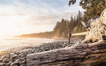 Man looking out from beach in Juan de Fuca Provincial Park, Vancouver Island, British Columbia, Canada Stock Photo - Premium Royalty-Free, Code: 649-08859998