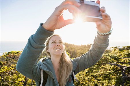 Female hiker taking selfie in coastal forest, Pacific Rim National Park, Vancouver Island, British Columbia, Canada Stock Photo - Premium Royalty-Free, Code: 649-08860027