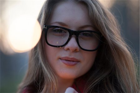 portrait confident women wearing glasses - Portrait of young woman wearing spectacles Stock Photo - Premium Royalty-Free, Code: 649-08860121