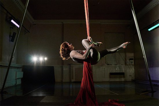 Young female aerial acrobat horizontal on silk rope Stock Photo - Premium Royalty-Free, Image code: 649-08860530