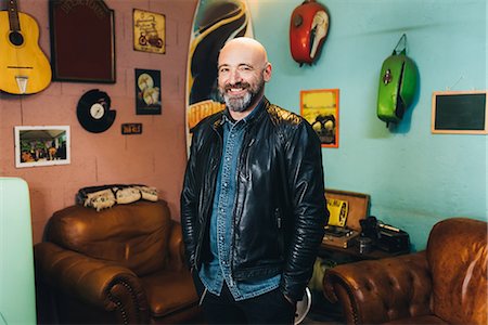 portrait guy in his garage - Portrait of mature man, indoors, smiling Stock Photo - Premium Royalty-Free, Code: 649-08894190