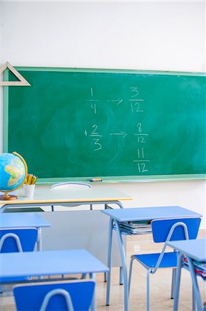 Empty classroom, maths problem on blackboard Stock Photo - Premium Royalty-Free, Code: 649-08894807