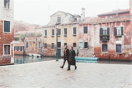 people venice - Couple strolling by canal waterfront, Venice, Italy Stock Photo - Premium Royalty-Free, Code: 649-08900832