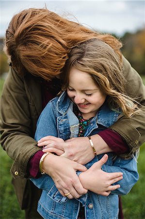 Mother and daughter hugging in meadow Fotografie stock - Premium Royalty-Free, Codice: 649-08900930