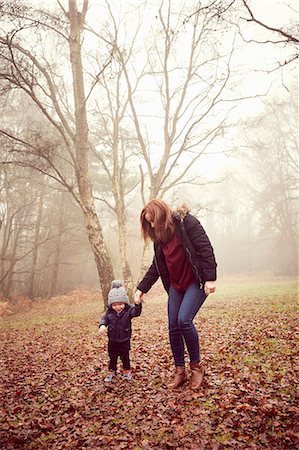 fall kids - Male toddler holding mother's hand in forest Stock Photo - Premium Royalty-Free, Code: 649-08901195