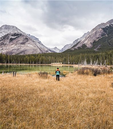 simsearch:614-08030743,k - Woman standing, looking at view, rear view, Kananaskis Country; Bow Valley Provincial Park, Kananaskis, Alberta, Canada Stock Photo - Premium Royalty-Free, Code: 649-08901676