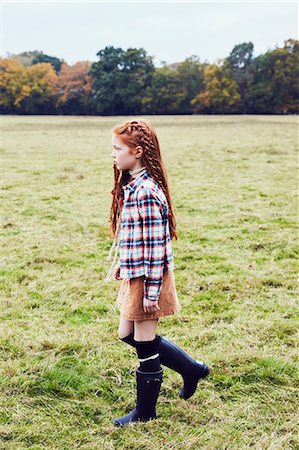 preteen girl redhead - Young girl, walking through field Stock Photo - Premium Royalty-Free, Code: 649-08901727