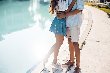 simsearch:649-07710200,k - Neck down view of young couple hugging on poolside, Koh Samui, Thailand Foto de stock - Sin royalties Premium, Código: 649-08902269