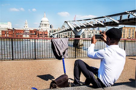 Businessman with scooter photographing St Paul's Cathedral, London, UK Stock Photo - Premium Royalty-Free, Code: 649-08924109