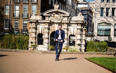 Businessman on scooter, London, UK Stock Photo - Premium Royalty-Free, Code: 649-08924123