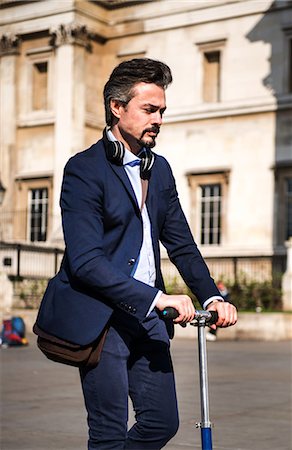 pictures of people riding scooters - Businessman on scooter, London, UK Stock Photo - Premium Royalty-Free, Code: 649-08924136