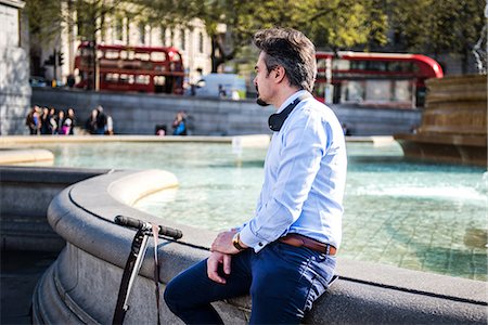 full picture of the male - Businessman beside scooter, Trafalgar Square, London, UK Stock Photo - Premium Royalty-Free, Code: 649-08924131