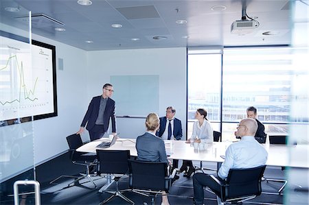 success graph - Businessman making flat screen presentation to team in boardroom Photographie de stock - Premium Libres de Droits, Code: 649-08924360