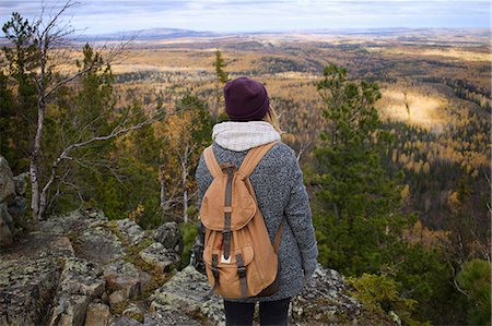 simsearch:614-08990349,k - Young woman standing on mountainside, looking at view, Sverdlovsk Oblast, Russia Stock Photo - Premium Royalty-Free, Code: 649-08924694