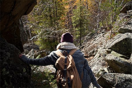 simsearch:614-08990349,k - Young woman hiking, leaning on rock, rear view, Sverdlovsk Oblast, Russia Stock Photo - Premium Royalty-Free, Code: 649-08924697