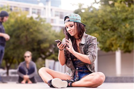 south africa and young adult and music and one person - Dancer texting on mobile phone Stock Photo - Premium Royalty-Free, Code: 649-08922767