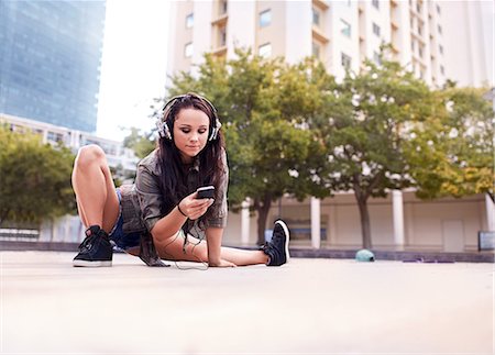 south africa and young adult and music and one person - Dancer texting on mobile phone, Cape Town, South Africa Stock Photo - Premium Royalty-Free, Code: 649-08922771