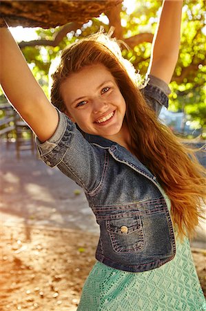 simsearch:649-08923565,k - Portrait of teenage girl hanging from tree branch Stock Photo - Premium Royalty-Free, Code: 649-08922965