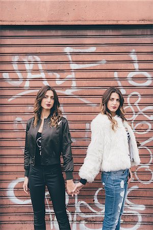 simsearch:649-08923050,k - Portrait of twin sisters, in urban area, holding hands Stock Photo - Premium Royalty-Free, Code: 649-08923069