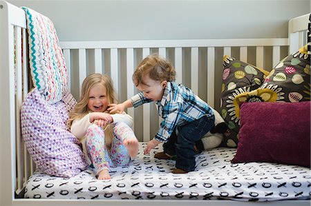 simsearch:649-07596595,k - Male toddler and sister playing on day bed Stock Photo - Premium Royalty-Free, Code: 649-08923126