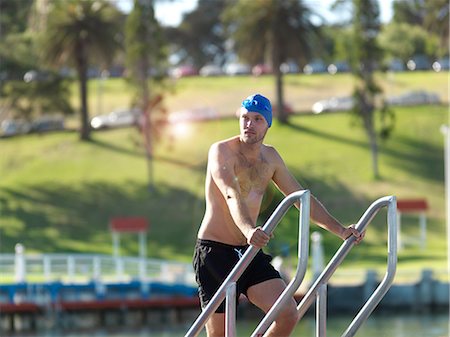 simsearch:614-06043548,k - Swimmer coming up from water on ladder, Eastern Beach, Geelong, Victoria, Australia Photographie de stock - Premium Libres de Droits, Code: 649-08923390