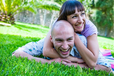 shaving man woman - Couple lying on grass, Mallorca, Spain Stock Photo - Premium Royalty-Free, Code: 649-08923495