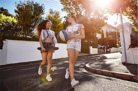 street corner - Teenage girls with ball and skateboard in street, Cape Town, South Africa Stock Photo - Premium Royalty-Free, Code: 649-08923564