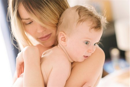 simsearch:400-04530129,k - Mother cuddling baby Stock Photo - Premium Royalty-Free, Code: 649-08923623