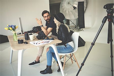 simsearch:6108-06168137,k - Photographer and stylist meeting in photography studio Stock Photo - Premium Royalty-Free, Code: 649-08923686