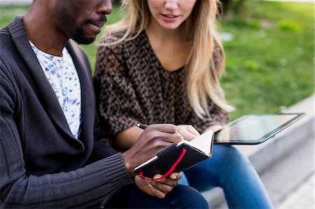 simsearch:649-08923913,k - Young businessman and woman making notes on city wall Stock Photo - Premium Royalty-Free, Code: 649-08923921