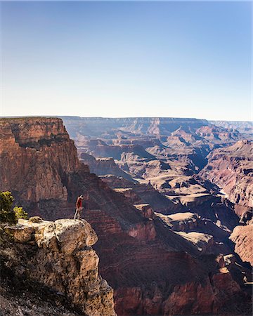 simsearch:649-08714266,k - Man looking down from the edge of Grand Canyon National Park, Arizona, USA Stock Photo - Premium Royalty-Free, Code: 649-08949330