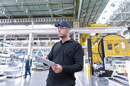 Apprentice engineer in steel pressing department of car factory Photographie de stock - Premium Libres de Droits, Code: 649-08949384