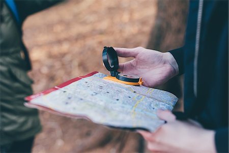 simsearch:649-08949532,k - Cropped shot of hiking couple orienteering with compass and map, Monte San Primo, Italy Stock Photo - Premium Royalty-Free, Code: 649-08949527