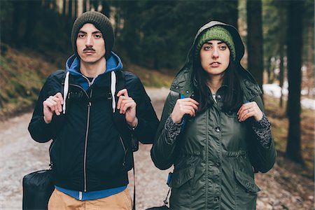 simsearch:649-08949532,k - Portrait of hiking couple wearing knit hats in forest, Monte San Primo, Italy Stock Photo - Premium Royalty-Free, Code: 649-08949547