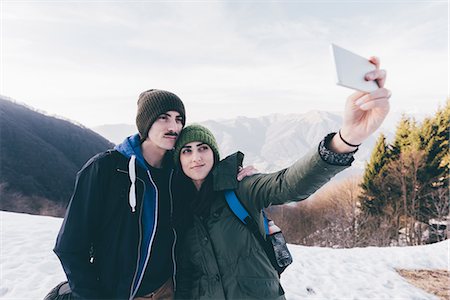 simsearch:649-09111243,k - Hiking couple taking selfie in snowy mountains, Monte San Primo, Italy Photographie de stock - Premium Libres de Droits, Code: 649-08949540