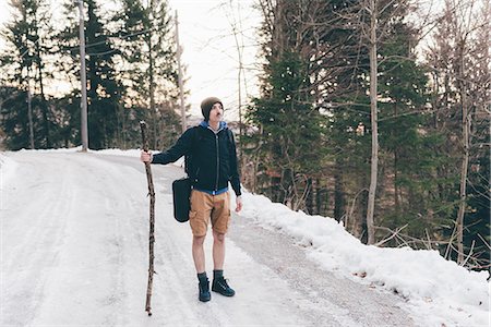 simsearch:649-08949532,k - Male hiker standing on forest road, Monte San Primo, Italy Stock Photo - Premium Royalty-Free, Code: 649-08949554