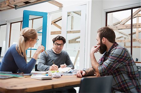 Female and male designers brainstorming at design studio desk meeting Foto de stock - Sin royalties Premium, Código: 649-08949805