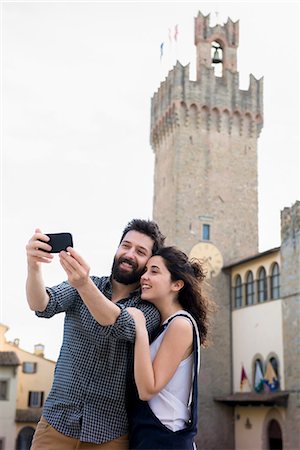 simsearch:649-08702811,k - Couple taking smartphone selfie by Arezzo Cathedral, Arezzo, Tuscany, Italy Stock Photo - Premium Royalty-Free, Code: 649-08949885