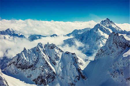 simsearch:649-08949986,k - Clouds on snow capped mountain peaks, Engelberg Titlis, Swiss Alps, Switzerland Photographie de stock - Premium Libres de Droits, Code: 649-08950061