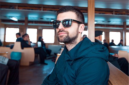 simsearch:649-08661387,k - Portrait of man on ferry wearing sunglasses, Istanbul, Turkey Fotografie stock - Premium Royalty-Free, Codice: 649-08950116