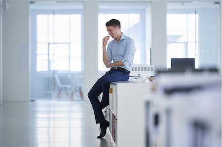 Man working in open plan office Stock Photo - Premium Royalty-Free, Code: 649-08950462