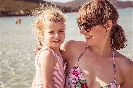 Portrait of mother and daughter at beach, smiling Stock Photo - Premium Royalty-Free, Code: 649-08950519